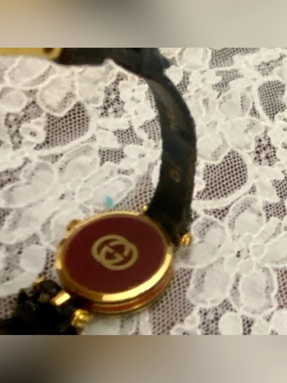 Gucci, Swiss Made, Quartz Gold Tone Ladies Watch with Burgundy Glass Backing